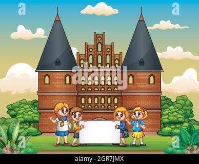Cartoon di bambini della scuola felice in piedi di fronte al palazzo Holstentor Illustrazione Vettoriale