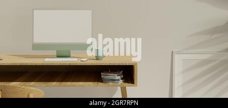 Primo piano, spazio di lavoro minimalista interno mockup con computer verde pastello in bianco schermo mockup su tavolo di legno, poster cornice mockup magra su bianco wal Foto Stock