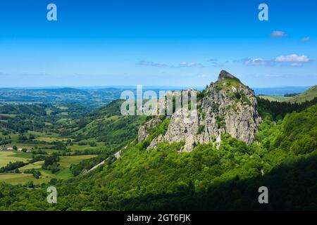 Tuiliere rocks and mountains in Auvergne landscape with blue sky, France Stock Photo