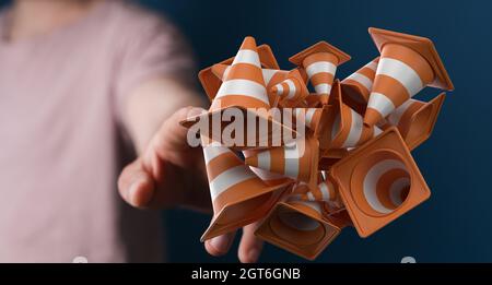 Rendering 3D di coni galleggianti di traffico con una mano che tocca dietro di esso - Sito web in riparazione concetto Foto Stock