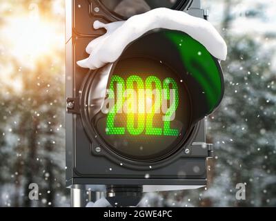 Felice anno nuovo 2022. Semaforo con semaforo verde 2022 nel parco innevato. illustrazione 3d Foto Stock