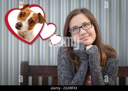 Fantasticando Cute girl accanto a cuori flottante con cucciolo all'interno. Foto Stock