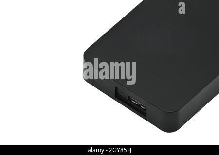 Disco rigido portatile per il backup di file vari isolato su un fondo bianco Foto Stock