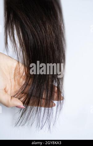 Finta Donna capelli. Falso sano di capelli lunghi Foto Stock