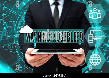 Didascalia concettuale Avvertenza Nosebleed, concetto che significa cautela sul sanguinamento dai vasi sanguigni nel naso uomo in Office Uniform Holding Tablet Disp Foto Stock