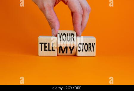 Raccontate la mia o la vostra storia. L'uomo d'affari trasforma i cubi di legno, cambia le parole raccontano la mia storia per raccontare la vostra storia. Bellissimo sfondo arancione, spazio copia. Autobus Foto Stock