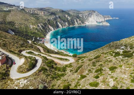 Strada a serpentina per Petani Beach a Cefalonia, Isole IONIE, Grecia Foto Stock