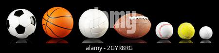 Varie palle isolate su sfondo nero - Ball Sport Panorama Foto Stock