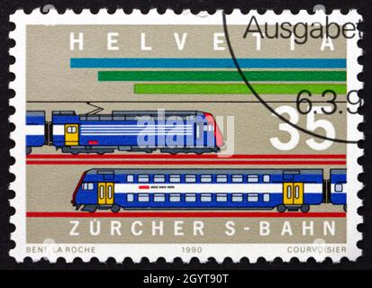 SVIZZERA - CIRCA 1990: Un francobollo stampato in Svizzera mostra locomotive, Urban Railway System, Zurigo, circa 1990 Foto Stock