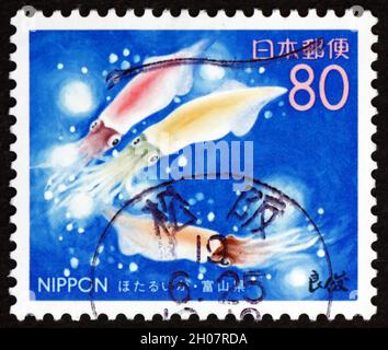 GIAPPONE - CIRCA 1999: Un timbro stampato in Giappone mostra Firefly Squid, Watasenia Scintillans, circa 1999 Foto Stock