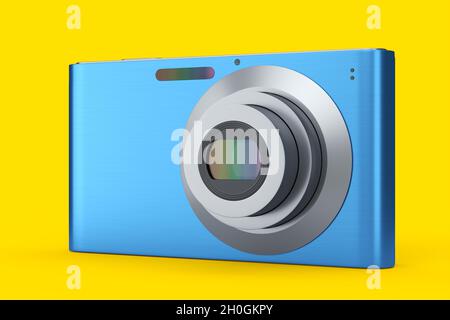 Elegante fotocamera digitale tascabile compatta blu isolata su sfondo giallo. Concetto di destinazione di viaggio in vacanza con rendering 3D Foto Stock