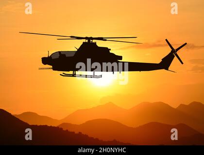 American Attack elicottero silhouette in volo Foto Stock