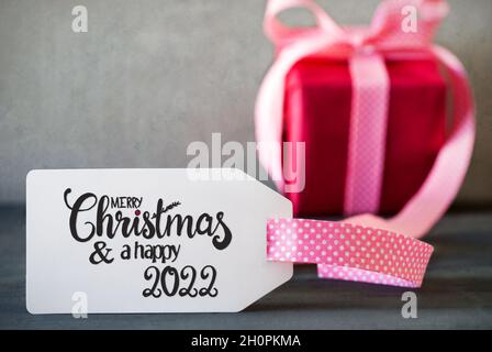 Regalo di Natale rosa, Natale allegro di Calligraphy e Un felice 2022 Foto Stock