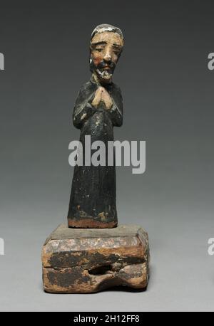 San Antonio: santo de bulto, XVII - XVIII secolo. America, Nuovo Messico, XVII - XVIII secolo. Legno dipinto; complessivo: 16,3 x 4,1 x 3 cm (6 7/16 x 1 5/8 x 1 3/16 in.); senza base: 16,2 x 3,9 cm (6 3/8 x 1 9/16 in.). Foto Stock
