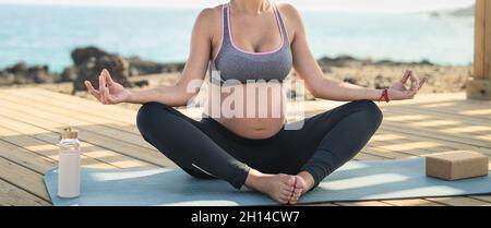 Young Pregnant Woman Doing Yoga Session Next The Sea Meditation