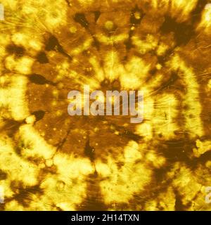 Tie Dye Spiral background. Tessuto Batik dorato. Vecchio Foto Stock