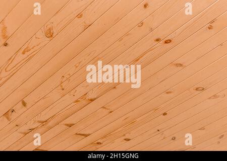 Disegno diagonale di pannelli di legno per soffitto esterno e asse interno superficie legno texture sfondo. Foto Stock