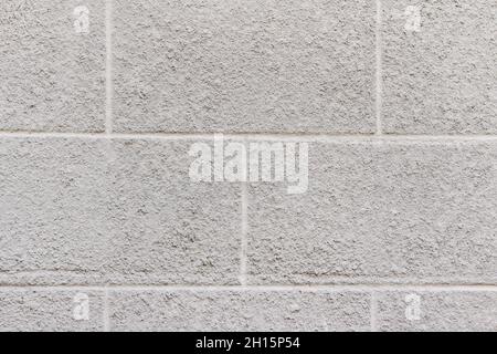 Trama fotografica della parete in stucco di cemento di colore grigio. Foto Stock