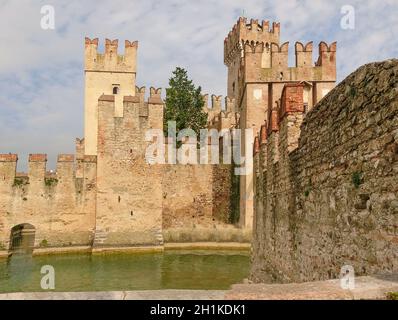 Sirmione, Italy - Scaliger Castle. The famous castle of Sirmione and its small port are an uncommon example of a fortress used as a port. The building Stock Photo