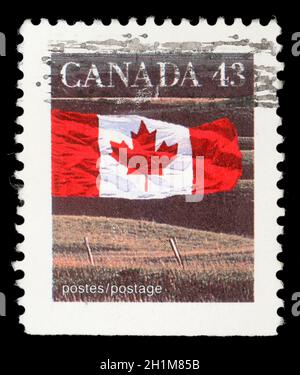 Timbro stampato in Canada mostra la bandiera canadese e Prairie, senza le iscrizioni, dalla serie 'Canadian flag', circa 1991 Foto Stock