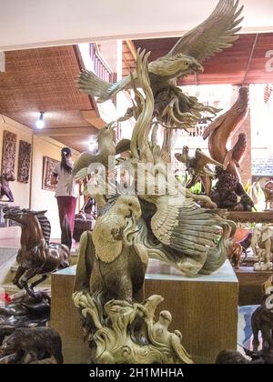 Ubud, Indonesia - April 12, 2012: Carved wooden statue in shop at Ubud, Indonesia Stock Photo