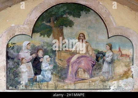 Gesù amico dei bambini piccoli, affresco nella Chiesa di San Michele a Vugrovec, Croazia Foto Stock