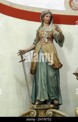 Santa Margherita, statua sull'altare maggiore nella chiesa di Santa Barbara nella Bedkovcina, Croazia Foto Stock