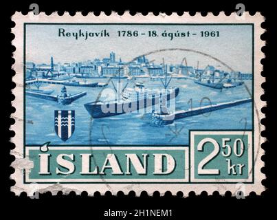 Timbro rilasciato in Islanda mostra il 175mo anniversario di Reykjavik, circa 1961. Foto Stock