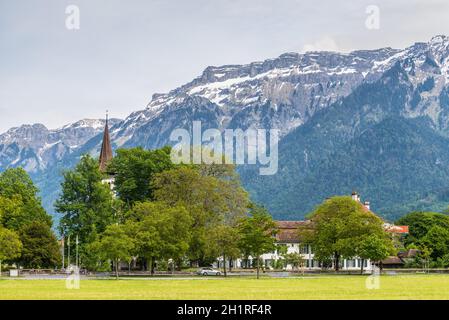 Interlaken, Switzerland - May 26, 2016: Beautiful landscape with snow-covered Swiss Alps in Interlaken, Switzerland. Stock Photo