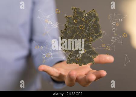 3D rendering mappa della Germania sulle mani di un maschio sullo sfondo Foto Stock