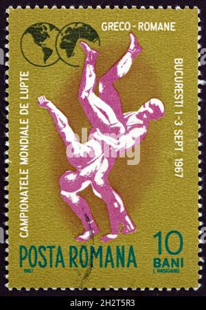 ROMANIA - CIRCA 1967: Un francobollo stampato in Romania mostra Wrestling, Fight Scene, circa 1967 Foto Stock