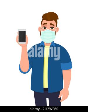 Giovane uomo hipster che indossa maschera medica e mostra il telefono. Persona alla moda che mostra smartphone. Carattere maschile che copre la protezione del viso da virus. Illustrazione Vettoriale