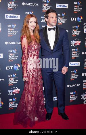 Una e ben Foden arrivano al BT Sport Industry Premi 2014 a Battersea Evolution - Londra Foto Stock