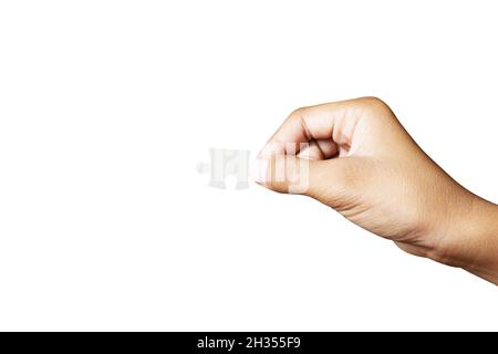 Primo piano tenendo un elemento puzzle isolato su sfondo bianco. Prodotto ad alta risoluzione. Foto Stock