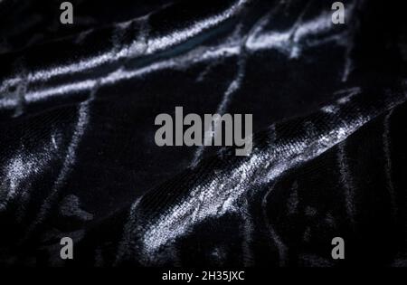 Tessuto astratto in velluto color nero cremoso di fondo Foto Stock