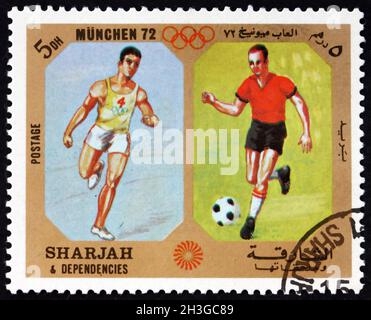 SHARJAH - CIRCA 1972: Un francobollo stampato negli Emirati Arabi Uniti di Sharjah dedicato ai Giochi Olimpici 1972, Monaco, Germania, circa 1972 Foto Stock