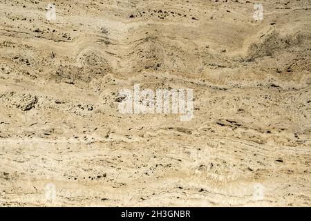 Primo piano di una pietra naturale astratta in calcestruzzo sul muro. Parete invecchiata con. Sfondo testurizzato Foto Stock