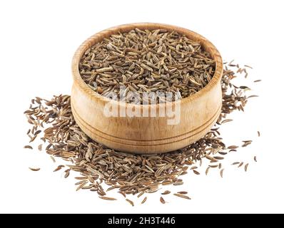 Semi di caraway in ciotola di legno isolato su sfondo bianco Foto Stock