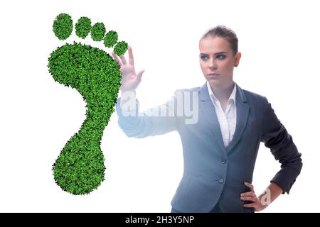 Concetto di ecologia con impronta verde e donna d'affari Foto Stock