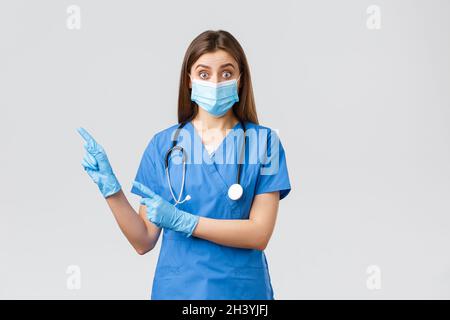 Covid-19, prevenzione di virus, salute, operatori sanitari e concetto di quarantena. Medico interessato e interrogato, infermiere in Foto Stock