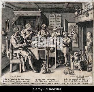 Una famiglia seduta attorno al tavolo da pranzo, la madre che serve cibo, il padre che fa un gesto autorevole verso il figlio che prega, le due figlie si siedono accanto alla madre mentre il bambino più giovane viene nutrito accanto al luogo del fuoco, rappresentando Concord. Incisione di C. de Passe dopo M. de Vos. Foto Stock