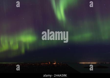 Aurora boreale su Reykjavík, Islanda Foto Stock