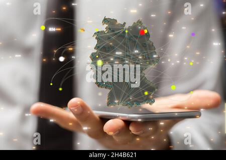 Mappa di rendering 3d della Germania composta da triangoli, linee in uno smartphone Foto Stock