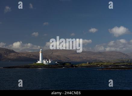 Eilean Musdile (Mansedale) isoletta e faro a sud-ovest di Lismore nelle Ebridi interne Foto Stock