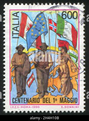 ITALIA - CIRCA 1990: Timbro stampato dall'Italia, mostra Labor Day, circa 1990 Foto Stock