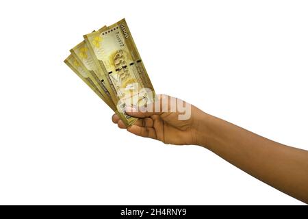 Tenuta di mano giusta 3D reso Sri Lanka rupie note isolate su sfondo bianco Foto Stock