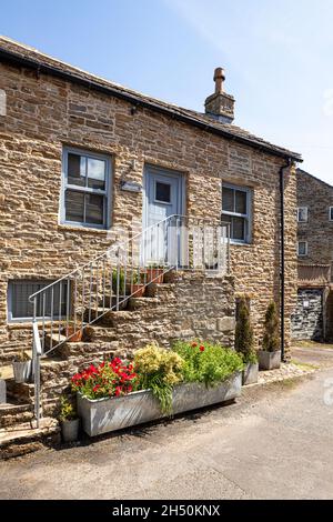 Un fienile di pietra conversione nella città di Pennines altopiano di Alston, Cumbria Regno Unito Foto Stock