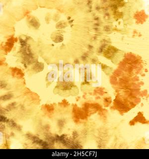 Tie Dye Spiral background. Tessuto Batik dorato. Foto Stock