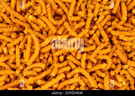 Chakri indiano saporito piccante riso croccante fondo snack bastone Foto Stock