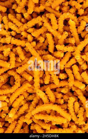 Chakri indiano saporito piccante riso croccante fondo snack bastone Foto Stock